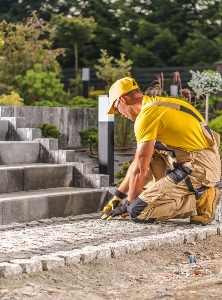 skilled-worker-laying-cobblestones-for-a-garden-pa-2026-01-09-11-55-34-utc